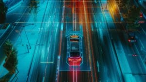 eine Luftaufnahme von oben eines autonomen selbstfahrenden Autos, das auf einer Stadtautobahn fährt.